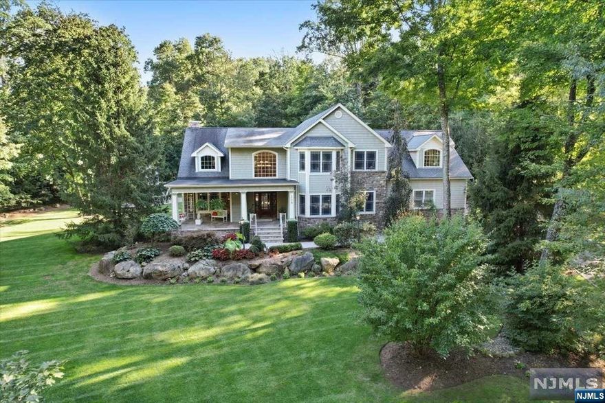 From the moment you arrive, the superior craftsmanship and attention to detail are evident in this 4700+ sqft estate. Step onto the lemonade porch & into the entry foyer that leads to a dining room w/ tray ceiling. The kitchen is a dream with cherry cabinets, farmhouse sink & high-end appliances, opening into the great room with 10-foot ceilings and a fireplace. This floor also includes a guest BR/office, mudroom, powder room & a second office. Upstairs, the primary suite features a walk-in closet, and a spa-like bathroom with a rain shower. Moving on there are two large BR's, a full bath, laundry room & another BR w/ full bath. The lower level surprises with a rec room, gym, movie theater & private guest room w/ensuite. Here there is also separate exterior access w/ options for an extended family suite. Outside, the composite deck, outdoor bar & fire pit create endless opportunities for outdoor enjoyment. Set on a private, picturesque lot, this home is a rare find!