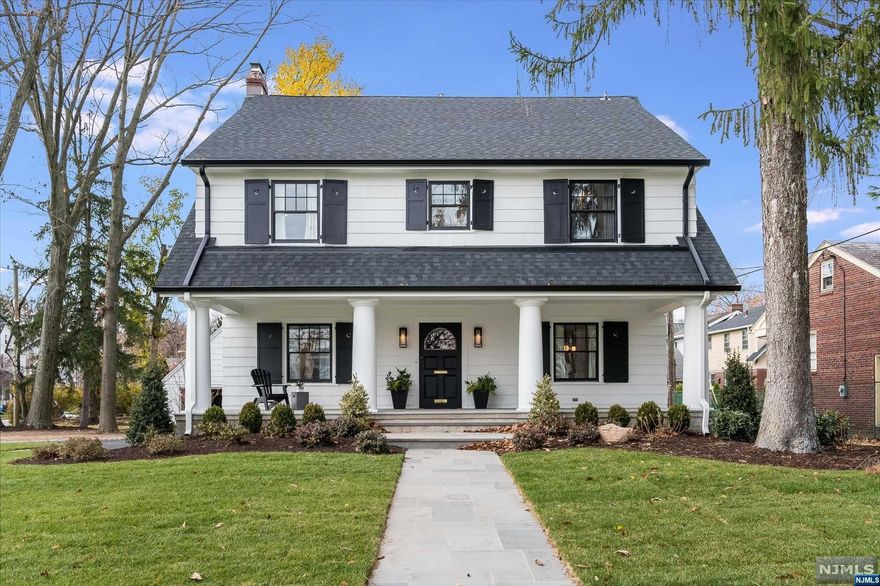 A Large bluestone porch welcomes you into this newly renovated home w/ highlights inc: refinished hardwoods, new paint, windows, roof, electric and plumbing, 2 furnaces and 2 zone central air. Fabulous floorplan perfect for WFH. Stunning kitchen w/ custom cabinetry, Viking appliances and quartz counters and island with seating opens to family rm w/ 13 ft beamed ceiling. Large liv rm w/ fireplace and formal dining rm. Mudroom and powder rm. All new custom lighting. Primary suite has 2 custom closets and full bath w/ dbl sinks. 3 beds, 3 baths on 2nd and 2nd floor laundry. 2 bedrooms, full bath on 3rd floor. Finished basement w/ powder and partial 9 ft. ceilings perfect for gym, media room, rec room. 2 car garage w/ new electric doors. Large, private, level lot, newly paved driveway and bluestone patio. Premier north end location steps parks, pools & NYC transportation