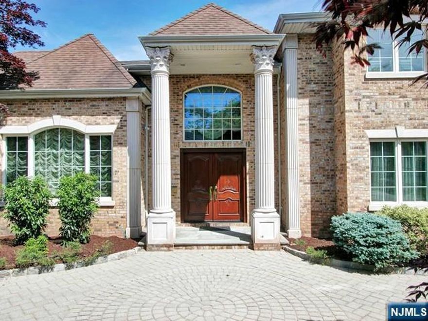 Welcome to one of the most exquisite residences in the coveted North Cliffs, ideally situated on one of the areaâ€™s most prestigious streets. This custom-built 5-bedroom, 6 full and 1 half bath estate showcases exceptional craftsmanship and timeless elegance throughout.A grand marble entry foyer sets the tone, flanked by a sophisticated formal living room and a banquet-sized dining roomâ€”perfect for both intimate gatherings and large-scale entertaining. Rich custom woodwork and intricate coffered ceilings, all crafted by master artisans, elevate every space.The heart of the home is a breathtaking great room featuring soaring floor-to-ceiling windows, a fireplace, and abundant natural light, seamlessly connecting to the outdoor oasisâ€”complete with a pool, patio, and fully equipped outdoor kitchen.The chefâ€™s kitchen, features radiant heated floors, premium finishes, and a spacious dining area, opening into a warm and inviting family room. Upstairs, the luxurious primary suite offers a serene retreat with a stunning newly designed marble bath. Three additional en-suite bedrooms complete this level, providing comfort and privacy for all.The fully finished lower level is designed for ultimate entertaining, featuring a large movie theater with fireplace, an elegant lounge area with wet bar, and an additional bedroom with a full bathâ€”ideal for guests or extended living. Donâ€™t miss this opportunity!!
