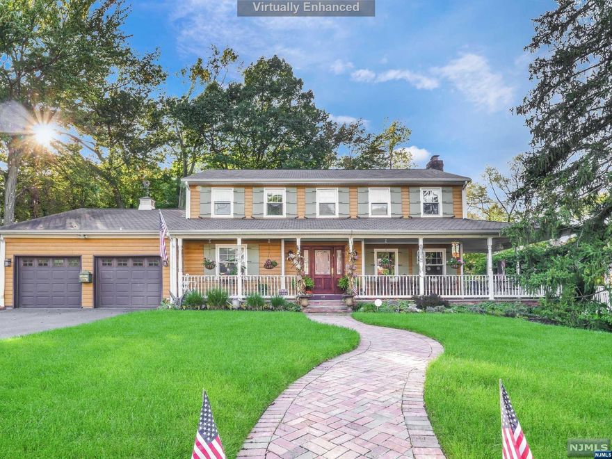 Nestled in timeless elegance, this 4 bedroom 3.5 bathroom Center Hall Colonial offers custom moldings, wood floors, and wrap-around porch in the desirable Packanack Manor section of Wayne. Step through the foyer where a formal living room with a fireplace, creates a space for relaxation. The adjacent dining room sets the stage for memorable gatherings. The heart of the home lies in the meticulously designed eat-in kitchen, with high-end appliances, custom cabinets, and a breakfast bar. The kitchen flows into a family room with vaulted ceilings, skylights, and wood-burning stove. French doors lead to the serenity of a rear deck. Nature surrounds you in this fully fenced in wooded yard offering space to create backyard memories. Ascend the staircase to discover the master suite boasting a luxurious stall shower, storage vanity and vaulted ceilings plus 3 add'l bedrooms and full bathroom. Full finished basement offers rec room, laundry room, and storage. 2-car attached garage.