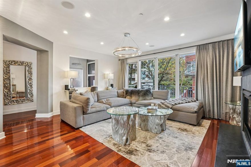 Gold Coast Luxury Redefined at 25 Vela Way! Experience world-renowned contemporary architecture and extraordinary modern design in this exceptional 4,600 sq. ft. end-unit townhome. The soaring living room dazzles with a dramatic high ceiling, gas fireplace, and floor-to-ceiling windows, seamlessly flowing into a gourmet kitchen featuring top-of-the-line appliances and honed granite countertopsâ€”perfect for entertaining or culinary excellence. The master suite is a private sanctuary, offering a spa-inspired bathroom, private balcony, expansive floor-to-ceiling windows, and customized oversized walk-in closets. Each level boasts its own private balcony, providing serene outdoor retreats with stunning views. Ascend via the in-unit private elevator to the top-floor solarium, which opens to a wrap-around rooftop deck with sweeping north and south river vistas, where sunrises shimmer over the water and sunsets create a cinematic skyline. Luxury finishes abound, including Brazilian cherry wood floors, multi-zone AC/heat, designer window treatments, exquisite lighting and chandeliers throughout, 2-car garage with additional driveway parking, and access to a resort-style outdoor pool. The bonus lower level offers a perfect gym and recreational studio, completing this extraordinary residence. Custom painted throughout, this extraordinarily large end unit embodies the ultimate Gold Coast lifestyleâ€”luxury, sophistication, and panoramic riverfront views at every turn.