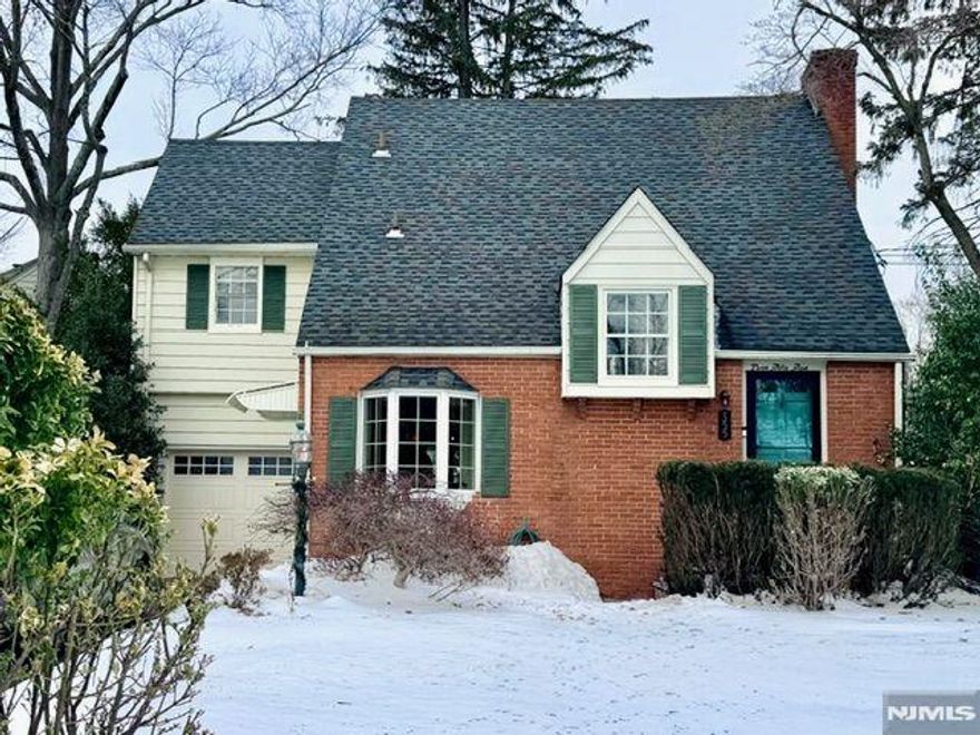 Bright and sunny with elegant charm, this expanded Colonial offers a versatile floor plan for comfortable living and easy entertaining. The inviting living room features a fireplace and streaming daylight from oversized windows, opening to a delightful three-season sunroom overlooking the beautiful inground pool and patio. An entertainment-sized dining room flows seamlessly into the sunny, modern eat-in kitchen with bay windows, and into the spacious family room with a second fireplace. This versatile room with powder room and closet can also serve as a guest room or future first-floor primary suite. Upstairs, the expansive primary bedroom includes a renovated ensuite bath, along with two additional bedrooms, hall bathroom, and a generous flex space ideal for a home office or play area. A finished basement rec room, fully fenced yard, and idyllic neighborhood convenient to schools, town, and transportation complete the perfect setting to enjoy all that Ridgewood has to offer