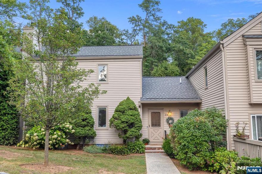 Don't miss this exceptional opportunity to own a beautiful 2 bedroom townhome in the sought-after Somerset Hills Village! From the moment you step inside, you're welcomed by an open-concept main level featuring gleaming hardwood floors, custom finishes, and a warm, inviting atmosphere. The spacious kitchen is a true standout, boasting granite countertops, new stainless steel appliances (2023), dual breakfast bars, and space for an eat-in table or island ideal for both everyday living and entertaining. The living room exudes charm with a cozy wood-burning fireplace that anchors the space perfectly. Upstairs, you'll find two generously sized bedrooms. The primary suite offers a massive walk-in closet, while the second bedroom delights with a built-in window seat. The fully finished basement provides endless versatility. Use it as a family room, home office, playroom, or rec space. You'll also love the custom barn door that opens to the laundry area with a washer and dryer replaced in 2019, and the impressively large storage options tucked away. Additional updates include windows replaced in 2020, a garage door replaced in 2022, and a new water softener and reverse osmosis system installed in 2024. Enjoy your own private patio, ideal for grilling or outdoor lounging, plus the convenience of an attached one-car garage. A rare gem that blends comfort, character, and convenience this townhome is truly move-in ready.