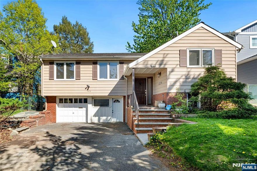 Welcome to 1675 Broad Street, a beautifully maintained 4 bedroom, 3 full bath single family home in the highly desirable Brookdale section of Bloomfield, right on the border of Montclair. This residence offers a rare combination of space, flexibility, and an unbeatable location. The main level features bright and airy living and dining areas filled with natural light, flowing into a renovated kitchen with stainless steel appliances and modern finishes. The primary suite offers two closets, an en suite full bath, and a skylight that fills the room with beautiful morning light. Two additional bedrooms and a shared full bath complete the upper level. The lower level offers additional finished living space with a full bath, laundry room, attached garage, and flexible bonus rooms ideal for a home office, guest space, recreation area, or extended living setup. Enjoy a private backyard ideal for entertaining or relaxing. Conveniently located near Brookdale Park, shopping, dining, major highways, and NJ Transit with easy access to New York City, this home offers the perfect balance of suburban comfort and commuter convenience.