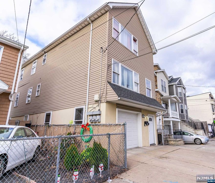 WOW- Newer construction with attached garage, hardwood floors, finished ground level with summer kitchen & full bath space with separate entrance on ground level, large backyard and so much more. 2nd floor delivered vacant- making this the ideal property for someone looking to live in one unit and receive additional monthly income. Come turn this house into a home before someone else does.