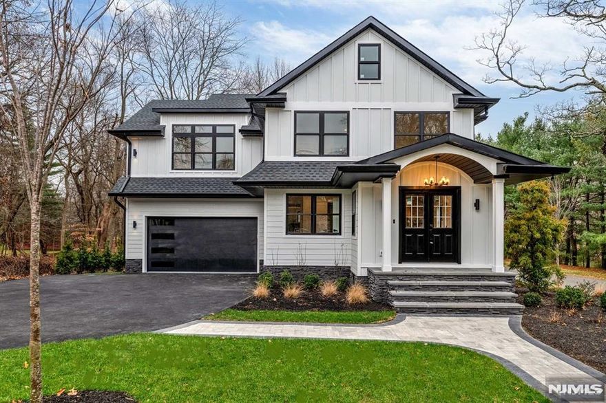 Absolutely spectacular new construction over existing foundation colonial in ultra-desirable Wyckoff! Featuring 5 bedrooms & 5.5 bathrooms, this new home offers an open-concept layout on the main level and is so spacious. You will fall in love with the truly beautiful finishes and design palette. The kitchen is the heart of the home with high-end, two-tone forest green & warm wood cabinetry. Huge center island and professional-grade SS appliances, including microwave in the island & beverage center. Kitchen is open to the large living and dining areas. Cozy gas fireplace and sliding glass doors to a large Trex deck that overlooks the private backyard. Bedroom and full bathroom on the main level. 4 bedrooms and 3 full bathrooms on the 2nd level + laundry. Primary oasis with beautiful en-suite bathroom & WIC. Fully finished basement w. an additional full bathroom & huge rec room plus storage. Wyckoff is a wonderful community with an amazing school district. You will love this home!