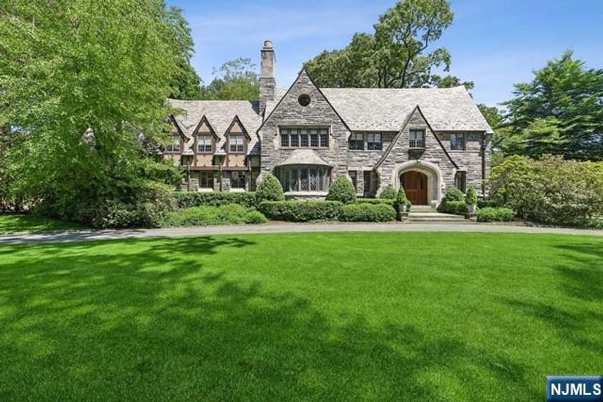 Pristine perfection is what you will find as you tour this truly lovely Estate Section manor home privately set on a corner property of over an acre. Strikingly beautiful welcoming foyer with a dramatic circular staircase, sunken living room with fireplace, heated sunporch/family room, handsome office with built-in bookcases, gracious formal dining room & renovated kitchen & pantry on first floor. Lavish primary suite with newer bathroom & luxurious sitting room/walk-in closet. Four more bedrooms & three more baths on the second floor plus laundry & a gym. Sixth bedroom plus storage on the third floor. Expansive lower level with fun rec room & bathroom. Sparkling inground pool with diving board highlights the beautifully landscaped backyard with patio & firepit. Designed in 1929 by internationally renowned CC Wendehack best known for his creation of the Winged Foot Country Club & others. Three car heated, attached garage. A very special home indeed!