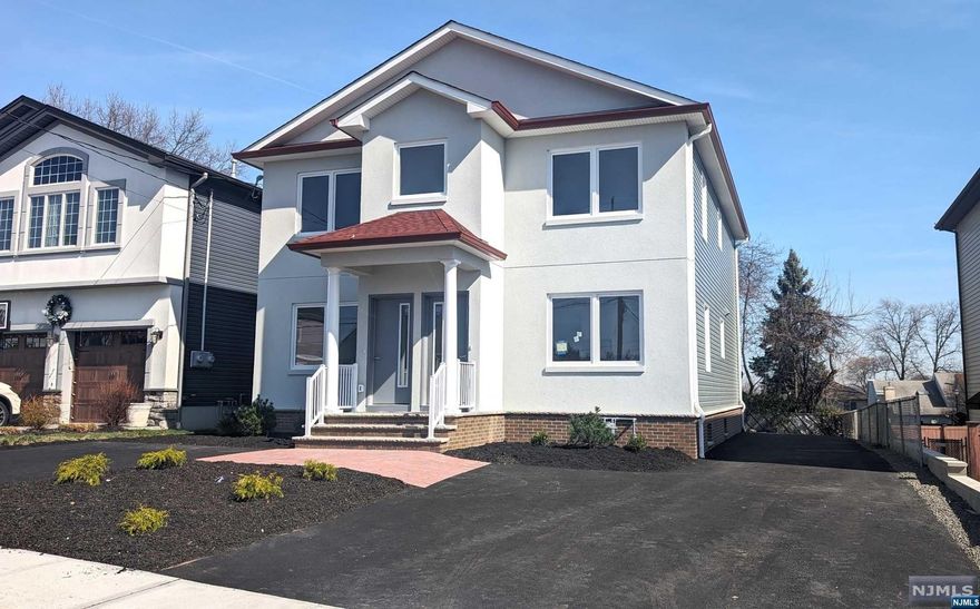 Absolutely stunning New construction two family. Built on an existing and new expanded foundation. Enter the 1st floor into a massive open floor plan with living room / dining area and modern kitchen with large center island. Quartz countertops, tiled back splashes and new stainless steel appliances. Three spacious bedrooms, all with built-in closets. Beautiful fullbath with a separate stand up shower and bathtub. Additional half bath and large linen closet in the hallway. 1st floor has access to large full basement. The second floor offers a similar layout with an additional small office and access to pull-down stair attic. Gorgeous hardwood floors throughout, oversized European windows, recessed lighting, and forced hot air heat and central air conditioning. Nice size yard and 2 separate driveways!! Close proximity to shopping, schools, and NYC transportation!