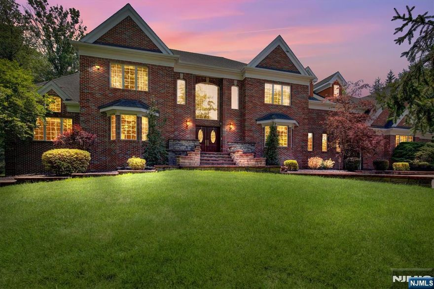 Behind a grand gated entrance, a heated paver driveway welcomes you home offering unmatched parking for up to 22 vehicles w/o obstruction. This stately brick-front residence blends timeless elegance with cutting-edge technology, beginning w/ double entry doors that open into a soaring two-story foyer designed to impress. Smart home integration controls every detail: lighting, security, thermostats, water systems, pool, hot tub, even the heated driveway and gated entry.Inside, luxury meets functionality in a spacious chef's kitchen, equipped w/ a Sub-Zero refrig., double ovens, downdraft cooktop, dishwasher, microwave & custom dining table w/ matching end tables all included. The fully finished lower level offers plenty of space along w/ a second full kitchen, standing shower bath. Access to & from the basement via the stairs in the garage.Retreat upstairs to four generously sized bedrooms with spa-like baths. The primary suite features a marble-clad master bath with jetted tub, heated floors, and a standing shower. All tubs throughout are jetted for your comfort. Outdoors features a pool, jacuzzi, gazebo & basketball court your own private resort awaits.Additional highlights include a 4-car garage w/ EV charger, 5-zone heating & cooling, 2 tankless water heaters (one dedicated to the driveway), 2 private wells, multi-zone irrigation, 2-sump pumps, whole house generator & a new roof (2025). Generous storage throughout the house at every level, this home is a must see!