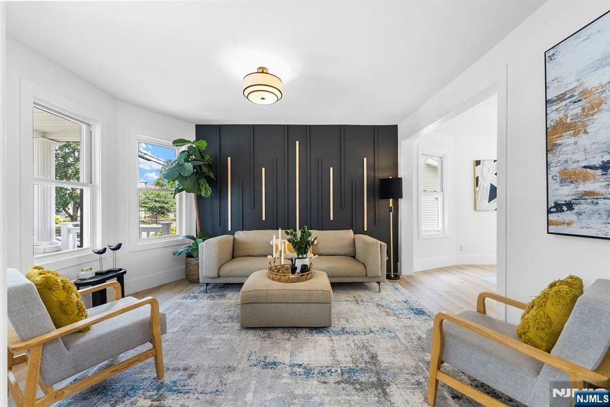 Discover this updated 4-bedroom, 2-bath Colonial located in one of Clifton's most desirable neighborhoods. Perfectly situated near NYC trains, buses, and major highways, this home blends modern comfort with unmatched convenience without being in a flood zone. Inside, you'll find a sun-filled living room with timeless charm and thoughtful upgrades, along with new central air for year-round comfort. The beautifully remodeled bathrooms add a touch of elegance, while the fully finished basement offers versatile space for a home office, gym, or entertainment area. Enjoy outdoor living on the spacious deck overlooking a generous backyard ideal for summer gatherings or quiet relaxation. A wide two-car detached garage provides plenty of storage or room for your next creative project. With close proximity to schools, shopping, parks, and local amenities, this move-in ready home delivers the best of suburban living paired with effortless access to New York City. Don't miss your chance to make this Clifton gem your own!