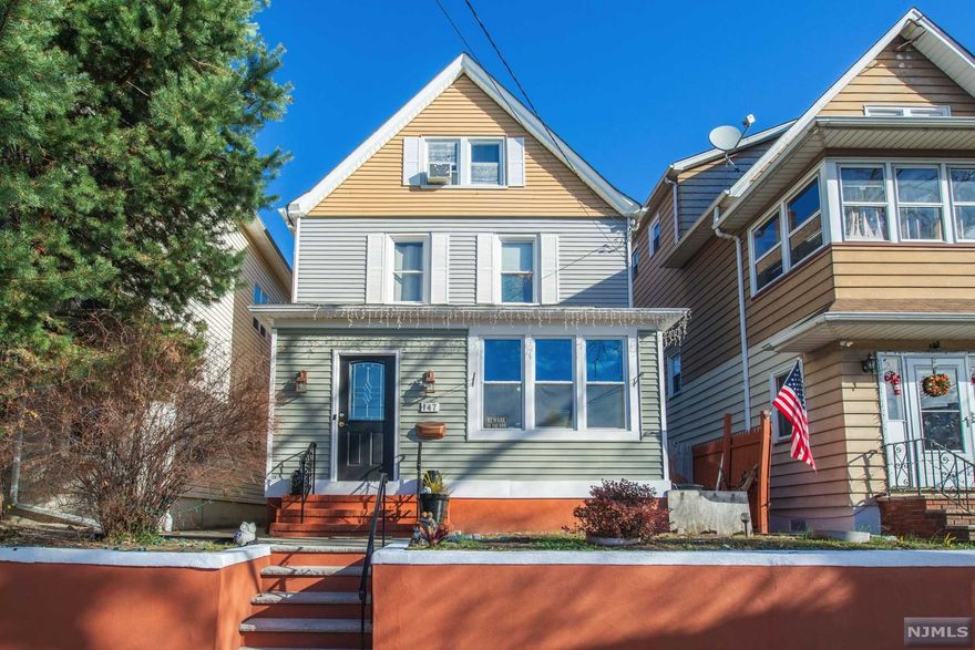 Renovated Move In Colonial Home Perfectly Situated Steps Away from NYC Trans.This Spacious Home Offers 3 Bdrms 2 Updated Bathrooms, Large Finished Attic that Can be Easily Used as Additional Room and Partially Finished Bsmt. Main Floor Welcomes You to Bright Liv Rm that Leads to Renovated Kitchen.This Gorgeous Kitchen Offers Quality Cabinets,Newer SS Appls, Breakfast Bar and Granite Ctrl. Separate Dining Area. Sliders to Deck Overlooking Private Fenced In Yard Perfect for Entertaining. Storage Shed.Generous Size Freshly Painted Basement with Full Bath and Walkout. Hrdw Floors,Recessed Lighting,Crown Moldings Newer Roof & HtWtHT. Close to NYC Trans,Major Highways, Parks,Schools and Shops. LOW TAXES ! COMMUTERS DELIGHT !