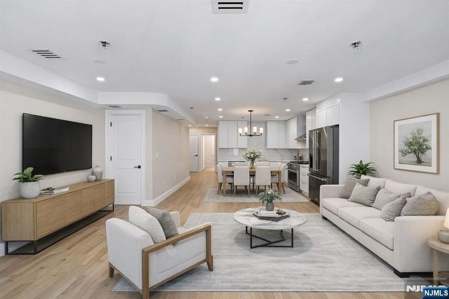 Luxury living defines this beautifully designed duplex spanning the third and fourth floors, offering 3 bedrooms and 3 full baths with a highly functional and spacious layout. The chef inspired kitchen is equipped with premium new Thor appliances and a dedicated pantry, seamlessly flowing into the main living and dining areas filled with natural light. A main level bedroom provides flexibility for guests or home office use. Two of the three bedrooms feature ensuite baths and walk in closets, delivering comfort and privacy, while all spaces are finished with hardwood flooring throughout for a cohesive, elevated look. Thoughtfully designed with modern living in mind, this home offers both style and versatility in every detail. Located in a prime location!