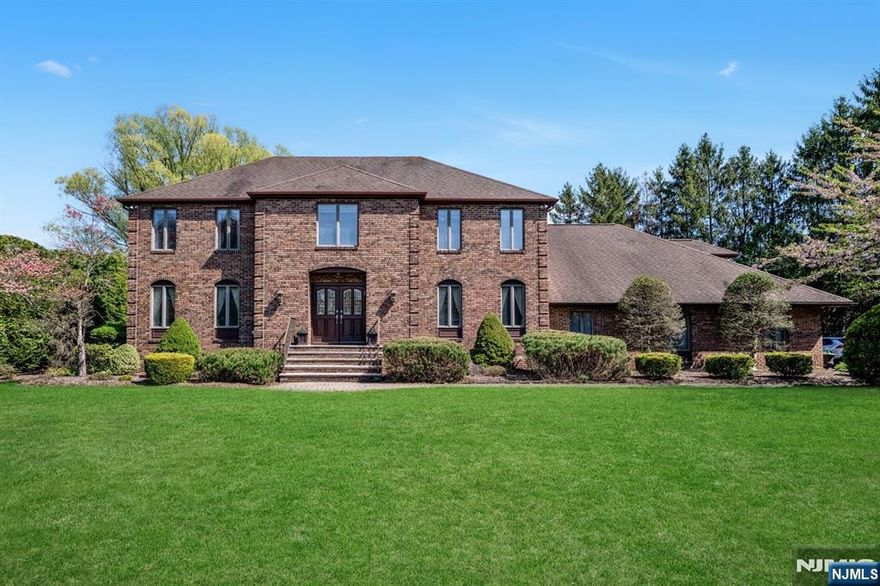 Nestled on nearly an acre of beautifully landscaped grounds, this stunning colonial-style residence is tucked away on a peaceful cul-de-sac in one of Norwoodâ€™s most desirable neighborhoods. Boasting an expansive floor plan, this home offers the perfect balance of elegance, comfort, and functionality. With 4 spacious bedrooms, 4.5 bathrooms, and a rare 3-car attached garage, the home welcomes you with a grand entry foyer and showcases custom finishes throughout. The modern kitchen features granite countertops, top-tier appliances, and a bright, inviting dining area. Just off the kitchen, a sun-drenched four-season sunroom, surrounded by windows and French doors, opens to a generous patio overlooking your private backyard oasis. Enjoy resort-style living with a heated gunite pool and a well-appointed cabana that includes a full bath, microwave, and refrigerator, perfect for summer entertaining. Upstairs, a spacious bonus room above the garage has been transformed into a sophisticated cigar lounge and recreation area with its own full bathroom. The fully finished basement offers a home theater, gym, and a convenient summer kitchen. Set in the charming town of Norwood, known for its top-rated schools, small-town appeal, and proximity to Route 9W and NYC, this exceptional property is a rare opportunity.