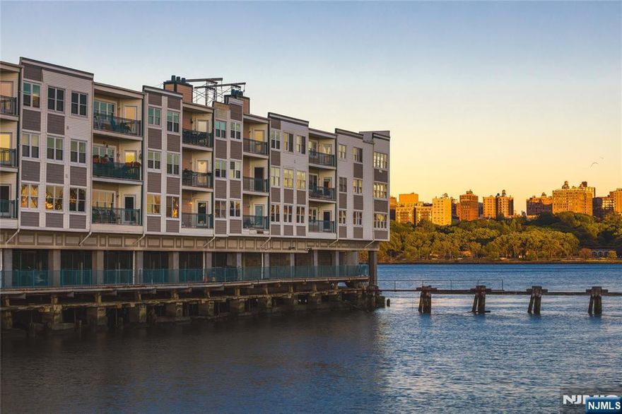 This is south facing, deluxe size unit, is literally over the Hudson River. Enjoy incredible sweeping views down the river from Manhatton to the NY Harbor. The home gets lots of sunlight all day and gets great sunsets too; especially from the terrace. This is also one of the largest floor plans at "The Promenade", making this one a very desirable home, especially for this price. It has generous space, from the large open kitchen, to the Master Suite w/an 11" x 6"ft. closet. The luxurious master bath has a double vanity, Jacuzzi tub, & separate stall shower. The Promenade is a unique gated community offering many surprises, such as the quiet courtyard walkway that stretches the entire length, the gym and hot tub with enviable city and river views. It also has a gatehouse and is conveniently located along the river walk, and at City Place. This comes w/1 garage spot (#70) and has visitor parking too. [ add Special assessment of $674 p/mo. thru 2031 + $121.68 (roof) thru 2032 to HOA].