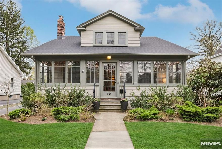 Prepare to fall in love with this effortlessly chic turn-key Craftsman-style home in Glen Rock, set on an expansive park-like double lot of approximately 0.65 acres, ideally located near vibrant downtown Glen Rock. An inviting enclosed mahogany front porch extends the living space and offers a warm lounge, reading retreat, or easy hosting area, welcoming you into a light-filled interior with a move-in-ready feel throughout. Seamless flow from the living room with beamed ceiling and wood-burning fireplace to the dining room and a beautiful modern custom kitchen with breakfast nook, versatile den with French doors and custom built-ins, and a powder room. Four spacious bedrooms, including a rare first-floor primary suite with a generous closet, updated ensuite bath, and French doors opening to a private rear porch â€”upstairs features three well-proportioned bedrooms and a full bath. Additional highlights are a newer roof, central AC, recessed lighting, a recently refinished lower level, and almost all windows recently replaced, plus hardwood floors throughout and a two-car garage. Outdoors, find a patio for dining and entertaining and sprawling backyard setting providing a serene retreat where the possibilities are countless, all close to top-rated schools, parks, and NYC transit.