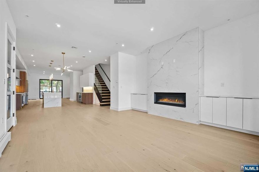 Welcome to 1224 16th St, a High End Duplex with Private Rooftop built by one of Gold Coast's Top Builders, MM Bergen Developers. This new construction home features 3 bedrooms, 3 full bath and 2 half bath. First floor's open layout offers a kitchen with Bosch Stainless Steel appliances, quartz counters / backsplash & oversized waterfall island, professionally designed powder room, LR and DR with custom shelving and cabinetry throughout, Eat In Kitchen Nook, baseboard heating, Engineered white oak floors, Int/Ext glass railings, speakers and direct access to backyard deck off kitchen. Second floor offers 2 vaulted ceiling bedrooms, full bath, laundry rm, Master Bedroom with walk in closets and Master Bath w/ oversized rainfall shower, soaking tub and heated floors. Third floor offers private roof top with beautiful views. Completing your home, the ground level offers large Rec Rm / Bedroom, Full Bath, direct access to professionally landscaped backyard and oversized garage