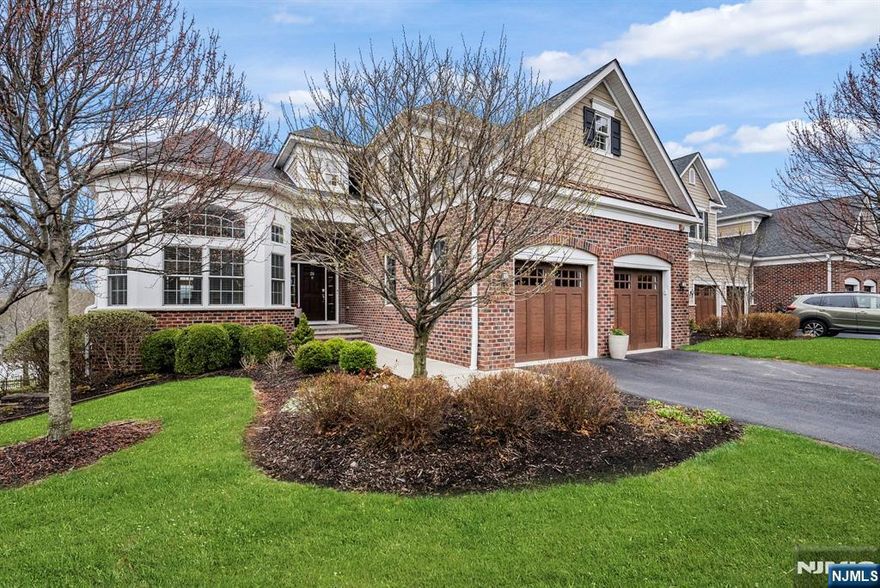 Welcome to this exceptional luxury end-unit townhome offering 4 bedrooms, 4 full baths, and 1 half bath in an intimate boutique community of just 23 residences. Ideally located just one mile from downtown Morristown, this home blends refined elegance with everyday convenience. Step inside to soaring ceilings, intricate detailed trim work, and stunning coffered ceilings that elevate the main living spaces with timeless architectural character. The thoughtfully designed floor plan features a highly desirable first-floor primary suite, offering comfort, privacy, and effortless living. This turnkey residence has been freshly painted and showcases brand-new flooring throughout, creating a crisp, modern aesthetic. The open-concept layout seamlessly connects the living, dining, and kitchen areas ideal for both entertaining and everyday living. Enjoy outdoor living with a private patio and a spacious deck off the kitchen, perfect for morning coffee or evening gatherings. The finished garage is a true standout, featuring epoxy-coated floors and custom built-in cabinetry, offering both functionality and a polished, high-end feel. Located near scenic Patriot's Path with access to miles of walking and biking trails, and just moments from shopping, dining, and major commuter routes. A rare opportunity combining luxury, location, and low-maintenance living this hidden gem is not to be missed.