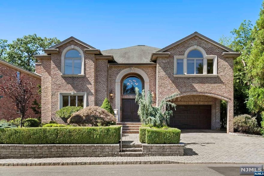 Magnificent custom built all brick colonial located in prestigious and sought-after Bluff Section of Fort Lee, this residence epitomizes luxury living. This immaculately maintained and pristine 5 Bedroom / 5.5 Bath has a gourmet eat-in kitchen with top of the line stainless steel appliances and over-sized center island adjoining a fabulous dining room. Beautiful formal family room, living room and laundry room on the first floor. Features many amenities including radiant heat in all bathrooms and on the first floor, superior quality hardwood floors, crown moldings, 3 custom marble fireplaces and 1 outdoor fireplace overlooking a 32 ft. sparkling salt water swimming pool in professionally landscaped unique private back yard, 2 steam sauna shower rooms, cast iron bath tubs, wine cellar, home gym with dry sauna ready room, hand painted designer dining room lighting fixture, 2 wet bars, smart wired throughout and many more.