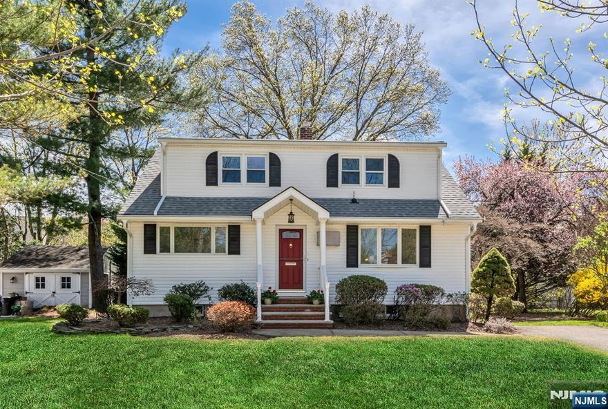 Tucked away on a quiet, tree-lined street, this updated Cape Cod has that home sweet home vibe with all the modern perks. It is just minutes to Hawes Elementary, the Glen Rock Duck Pond, and the scenic six-mile path through the Saddle River County Parks. The layout is super flexible, with two bedrooms and a full bath on the main level, ideal for single-floor living or guests, and office space. The kitchen has been updated with cream cabinets, granite counters, and stainless-steel appliances. The dining room flows right out to a spacious deck and a private backyard that is made for summer BBQs or relaxing with a book. Maintaining this beautifully landscaped property is a breeze with a sprinkler system, and a generously sized utility shed, perfect for all your garden and recreational storage needs. Upstairs, you have two roomy bedrooms and another full bath, offering space for everyone. Downstairs, there is a finished rec-room, laundry, and plenty of storage.