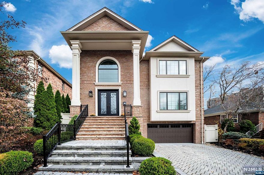 Absolutely Stunning Fort Lee home, only a few years young. Built by TOP Local Builder, with a portfolio of past projects that speak for themselves! PRIME BLOCK, surrounded by high value homes. 6 bedrooms and 6.5 bathrooms. Gorgeous 2 story entry foyer. 1st floor includes Formal LR, Formal DR with Wet Bar, DREAM KITCHEN that is open-concept and boasts huge center island & Sub Zero / Wolf Appliances, Family Room, 1st floor guest suite, and 1/2 bath. 2nd floors hosts 4 bedrooms and 4 full bathrooms. Primary Suite features double walk-in-closets and a spa-like primary bathroom. 2nd floor laundry for your convenience. DELUXE Basement with Movie Theater, Bedroom & Full Bathroom, Family Room, and access to 2 car garage. Fabulous upgrades include whole-house water filtration system, Generator, Alarm System, Custom Shades, 5 zone heating and cooling, and Lutron SMART HOME system. Easy access to NYC from this location, along with Dining, Shopping, Schools.