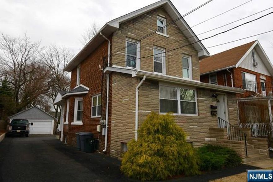 Updated 1 bedroom in super convenient location. 2 small bonus rooms - one in front and one den in back of apartment. Modern kitchen, 1 bedroom with lots of windows and closet, 1 full bath (shower over tub) . Extra features: great deck accessable from back door, washer and dryer in basement, energy efficient windows, 1 off-street parking space included. Chestnut Park across apartment. Easy commute to NYC - express bus stop very close! Electris heating is energy efficient and cost effective. Landscaping and partial snow removal included. Second parking spot available at incremental fee.