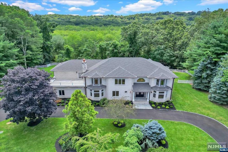 A breathtaking house on a one of kind private 2.8 acres property at the end of a cul-de-sac. A gorgeous two-story foyer welcomes you into this stunning colonial. This house features a great open floor plan with countless upgrades. Custom kitchen w/quartz countertops and high-end appliances, custom millwork throughout, custom glass wine room, and much more. First floor features a formal living and dining room, as well as a large living room with the kitchen being the center of the house. Laundry, mud area and a 3-car garage finishes the first floor. Upstairs you find a beautifully finished master suite, with large walk in closed, and large master bath featuring heated floors. 3 additional bedrooms and a junior suite complete the upstairs. Full basement and a backyard of complete privacy and trees as far as the eyes can see. A must see! LA related to seller.