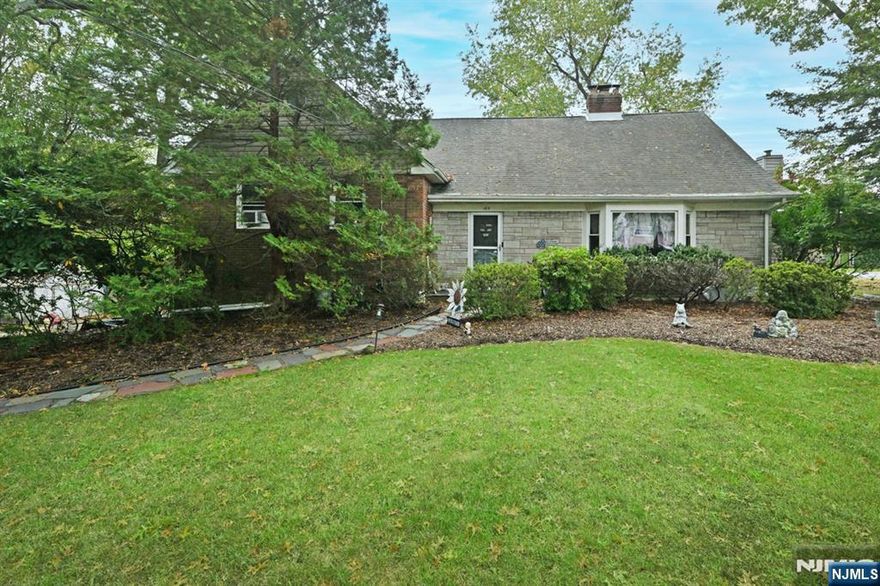 Wonderful setting for this expanded 4 Bedroom, 3 Full Bath Split Level home situated on a beautiful lot offering 128 x 160 property. The spacious entry foyer welcomes you and leads to the large living room offering hardwood flooring and a stunning wood burning stone front fireplace. Come into the expansive kitchen with island and dining area which leads to the family room w/gas fireplace. Great space for entertaining! 2nd floor offers 3 bedrooms and full bath with double sinks. Just a few steps up leads to the immense primary suite and primary full bath. The lower level is finished and offers a mud room/laundry room (egress door to driveway), rec room with wet bar, office and additional family room. Two Car Garage! Exterior offers a spacious deck with electric awning, above ground pool and immense fully fenced rear yard. Driveway is strictly As Is. AMAZING LOCATION AND HOME!!!