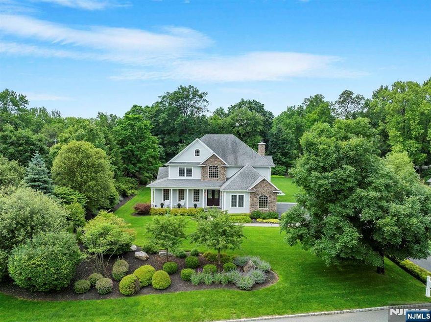 Nestled at the end of a peaceful cul-de-sac and directly across from the entrance to the scenic Tallman State Park in Palisades, this stunning 4 bedroom, 4 full bathroom Colonial with 3 car garage offers the perfect blend of luxury, comfort, and timeless craftsmanship. The home features a beautifully maintained stone and Hardiplank exterior designed for effortless upkeep, bluestone-covered front porch and thoughtful upgrades throughout. The spacious living room, anchored by a wood-burning fireplace has sliding glass doors leading to a patio perfect for entertaining. A dedicated home office with double French doors provides a quiet workspace for todayâ€™s modern lifestyle. The heart of the home is the custom chefâ€™s kitchen, outfitted with high-end Thermador appliances, custom cabinetry, and luxurious marble countertops. A covered bluestone back porch complete with two-zone flush-mounted heaters offers year-round enjoyment. The primary bedroom suite features tray ceilings, gas fireplace, generous closets, and spa-like ensuite bath. Additional bedrooms are spacious and bright. The walkout basement includes a finished studio room and rec room. Outdoor living is just as refined with a large, flat backyard, mature landscaping, fire pit, multiple patios and the backyard is perfect for a pool and cabana. Located in the desirable South Orangetown School District and 15 minutes from New York City. A must see!