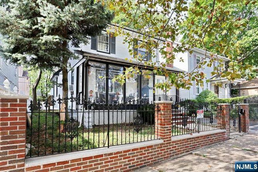 Welcome to this must-see, move-in-ready, and mostly renovated Colonial home located in a quiet residential neighborhood. This bright, open home offers ample space for comfortable living and entertaining. The first floor features a large living and dining area alongside a gorgeous renovated kitchen, complete with a large Quartz breakfast peninsula and a dry bar with a mini-fridge. For your convenience, this level also includes a full bathroom and a new laundry room. The second floor offers three bedrooms and a large main bathroom. Additionally, the newly finished walk-up attic provides space for an extra bedroom. The walk-out basement, has separate access, includes two rooms, a full bathroom, and a summer kitchen. Outdoor features include a deck, a two-car detached garage, and a gated driveway. The property is conveniently located near schools, shopping, and public transportation. With numerous upgrades throughout, do not miss the opportunity to own this beautiful home.