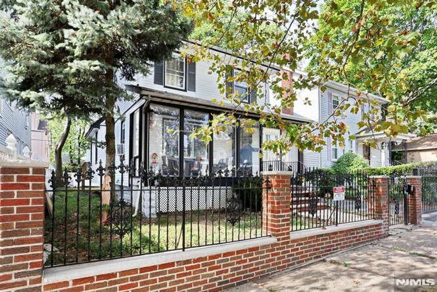 Welcome to this must-see, move-in-ready, and mostly renovated Colonial home located in a quiet residential neighborhood. This bright, open home offers ample space for comfortable living and entertaining. The first floor features a large living and dining area alongside a gorgeous renovated kitchen, complete with a large Quartz breakfast peninsula and a dry bar with a mini-fridge. For your convenience, this level also includes a full bathroom and a new laundry room. The second floor offers three bedrooms and a large main bathroom. Additionally, the newly finished walk-up attic provides space for an extra bedroom. The walk-out basement, has separate access, includes two rooms, a full bathroom, and a summer kitchen. Outdoor features include a deck, a two-car detached garage, and a gated driveway. The property is conveniently located near schools, shopping, and public transportation. With numerous upgrades throughout, do not miss the opportunity to own this beautiful home.