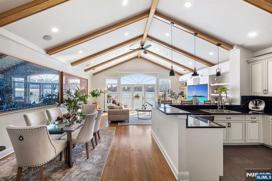 Located in the sought-after Bulls Ferry community, 18 Lydia Drive is a fully renovated waterfront residence offering panoramic NYC skyline and Hudson River views from the living, dining, and kitchen areas. This barn-style, loft-inspired home features soaring ceilings, exposed beams, and walls of oversized windows that fill the main living spaces with natural light throughout the day. The expansive private balcony, located off the living room, is ideal for entertaining or enjoying stunning city and river views. A private in-unit elevator provides seamless access between levels. The renovated kitchen and dining area showcase white cabinetry, quartz countertops and backsplash, and black stainless steel appliancesâ€”perfectly positioned to take full advantage of the sweeping views. Hardwood floors run throughout, adding warmth and continuity. The primary suite offers a peaceful retreat with a beautifully renovated spa-like bathroom featuring a soaking tub beneath a skylight. Additional highlights include, newer HVAC, private one-car garage plus driveway parking, and access to Bulls Ferry amenities including two pools with jacuzzis, waterfront promenade, shuttle to ferry, and easy NYC bus access. A rare opportunity for move-in-ready waterfront living just minutes from Manhattan.