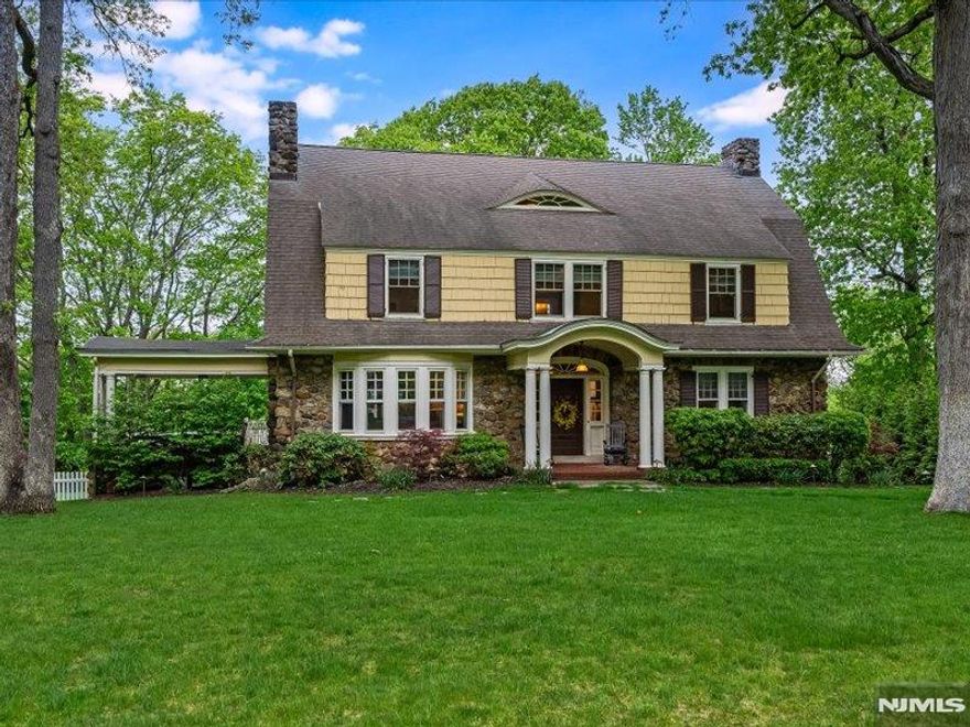 Classic, understated elegance on one of the finest streets in town! Rich in character and architectural detail, this fully renovated Colonial blends modern convenience with timeless design. Graciously sized rooms with high ceilings, beautiful hardwood floors and moldings, lovely fanlight windows and eyebrow dormers are all key elements of the home. Grand center-hall Foyer, formal Living and Dining Rooms with beamed ceilings and fireplaces, Sun Room, and charming open-air Porch that flows to large Deck that overlooks the lushly landscaped, fully fenced rear property. Renovated in 2023, the Chef's Kitchen features Wolf/SubZero appliances, quartz counters and wet bar and opens to huge Family Room with vaulted ceiling, casual dining area and French doors/sliders that open to Deck outside. Upstairs, the serene Primary Suite boasts a gas fireplace, walk-in closets and luxurious Bath with oversized shower and double vanity. Also on the second level are three additional Bedrooms that share an updated hall Bath. Two more Bedrooms and full Bath on the third level provide even more living space. New custom windows throughout (2023), Central Air and whole house Generator (2016). Essex Fells is known for its extraordinary natural beauty, excellent schools and unique charm, only 23 miles from NYC.