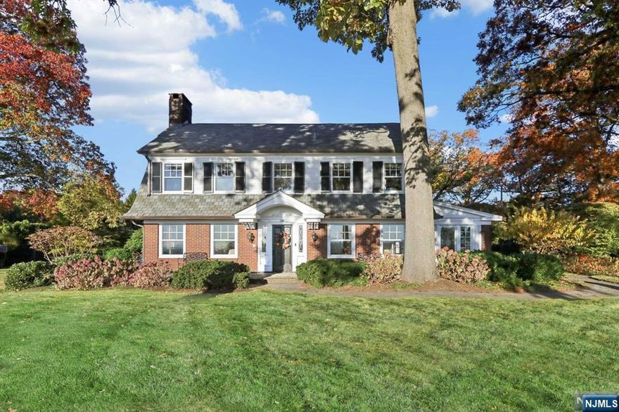 Located on one of the most sought-after streets in Ridgewood with unobstructed New York City skyline views, this center hall colonial is quintessential of everything the village has to offer. The functional overall flow combined with both modern and traditional elements makes this home the ideal space for everyday living and hosting. At the heart of the home, you'll find an updated eat-in kitchen equipped with the highest end appliances, a large center island, and sleek finishes. The kitchen seamlessly blends with the family room, showcasing a beautiful tray ceiling and oversized windows letting in tons of natural light. Upstairs, you'll find 4 bedrooms, 2 bathrooms, and a grand landing. An attached 2 car garage, backyard blue stone patio, and finished basement, perfect for casual entertainment, with a kitchen/wet bar complete the home. With its unmatched location, original charm, and updated interior, this gem offers a once in a lifetime opportunity.