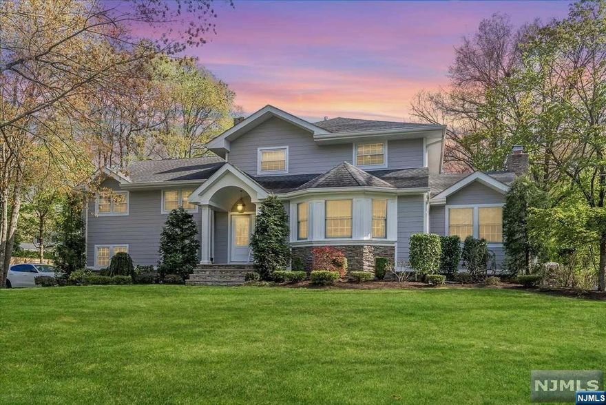 Discover this luxurious 4BR/3.5BA estate in Haworth's Manor section, nestled on a 140x125 lot beside a prestigious golf course. The home has undergone a complete renovation, featuring new PVC plumbing, sophisticated wood and tile flooring, and a chef's kitchen with quartzite counters and Viking appliances. The open layout includes a grand living room with a fireplace and deck access, a formal dining room, and a welcoming foyer that leads to a cozy sitting room. Upstairs, four spacious bedrooms await, alongside a fully finished basement with a sauna and wine room. Additional luxuries include an oversized garage with extensive storage, smart home technology, and vaulted ceilings. Situated in a safe, elite neighborhood with top schools, this estate is conveniently close to NYC with access to all major highways. Haworth Public School offers a 9:1 student-to-teacher ratio, and Northern Valley Demarest, ranking third in the state, ensures excellent educational opportunities.