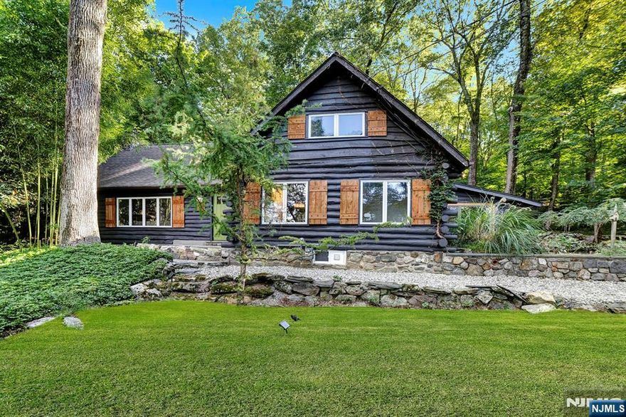 Welcome to this recently Renovated One-Of-A-Kind Hidden Gem Dream Retreat featuring a FIRST FLOOR PRMARY SUITE situated on over half an acre in the highly sought-after Lake Mohawk Community. The property is highlighted by seasonal lake views, lush privacy, established gardens, inviting outdoor spaces, wrap-around Porch / back Patio, tranquil bamboo and peaceful sounds of a babbling brook. Enjoy a Soaring Cathedral Beamed Ceiling Living Room with Skylights and awe-inspiring Stone Fireplace allowing relaxation at its finest. The Primary Suite includes ample closet space & an En-Suite Bathroom with a seated walk-in jetted Shower, radiant heated floors, and a bidet. The Chef's Kitchen features a high-end Italian Gas Stove, Stainless Steel Appliances, Calcutta Gold Marble Countertops, & custom slate floors. Ascend upstairs where you will find a spacious Loft Bedroom with a Half Bath, Sitting Room, Walk-In Closet & incredible views. Accentuating impressive curb appeal, a Large Backyard space, a serene setting, privacy, storage Shed & a MASSIVE Driveway offering TONS of parking, this is a rare opportunity to own one of the largest properties in Lake Mohawk. The Lake Mohawk Community offers year-round recreational activities including Boating, Fishing, Swimming, Beaches & a walkable Downtown with a Boardwalk, Shops, Eateries, Top-Rated Dining & much more. Sparta offers the #1 Rated School District in Sussex County. Come make this home yours before someone else does!