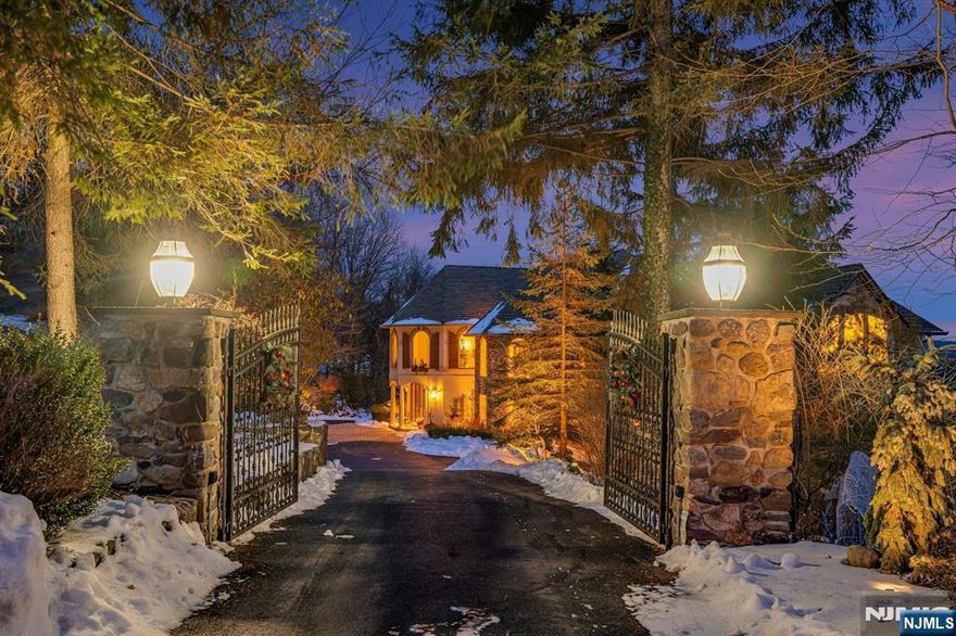 Welcome to The Summit situated in the heart of Smoke Rise on quiet culdesac, gated entry, prof lush grounds...Indulge in double staircase grandeur, custom wood details, stone and walnut flooring w/wetbar joins billiard rm and great rm with stone fireplace mantle and two-stories of glass w/overhead bridge; opens to kitchen with huge center island, Viking over-sized range, double thermador ovens, Miele dishwasher, subzero cherry fridge, walks out to private veranda for outdoor dining w/mystical mountain views. turret bkfst rm with walls of windows walks out to bbq/veranda; access to 3-car heated garage and Butler's pantry. Formal dining rm w/ soaring ceiling and strauss crystal chandelier with custom windows and ceiling detail. Chandeliers all on lifts. Entire main level is radiant heat! Retreat upstairs to two left wing BRs to share a bath, third level loft above w/storage, BR#3 w/private bath, sitting loft, grand primary suite w/dressing rm, 3 walk-ins, high ceiling, dressing rm w/vanity, reading bench, lux radiant heated bath w/privacy doors, soaring ceiling, double vanity, huge shower, closet, free standing tub w/jets, remote... The lounge and laundry rm complete the main ll. Lower level w/sep entrance w/BR#5, full bath, fam rm, theater, exercise, sauna, storage rm...Too many to list: whole home generator, fire-pit, swim spa/hot tub, over-sized heated pool, huge slide, rain shower, fire wall, surround sound, fountain, veggie & rose garden...