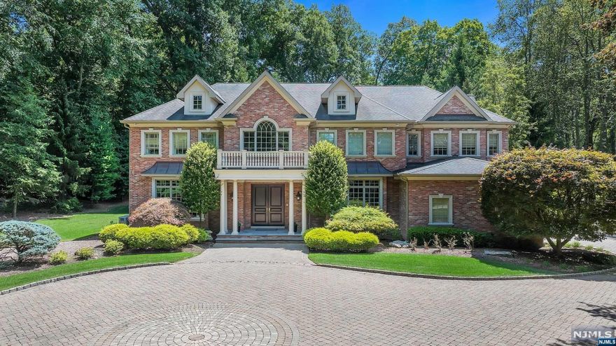 Stunning 5 bedroom, 7.1 bathroom home is a true masterpiece, originally built by a renowned builder. Enter the grand foyer, greeted by a warm & inviting atmosphere perfect for hosting glamorous soirees in the living room & great room or casual chats in the updated kitchen with marble countertops & backsplash. New custom powder room & newly designed dining room & butler's pantry complete the space for seamless entertaining. An elevator, office, full bathroom, & laundry room are discreetly tucked away on this level. 2nd floor reveals an intimate primary suite waiting for you to cozy up in front of the fireplace or unwind in the sitting room or luxurious bath. 4 additional en-suite bedrooms offer privacy for all. The basement extends the entertainment options with a full bath, playroom, TV room & office space. Outside you'll find paradise whether you're barbecuing, swimming or lounging in the hot tub. And with a generator you'll never worry about interruptions to your daily routine.