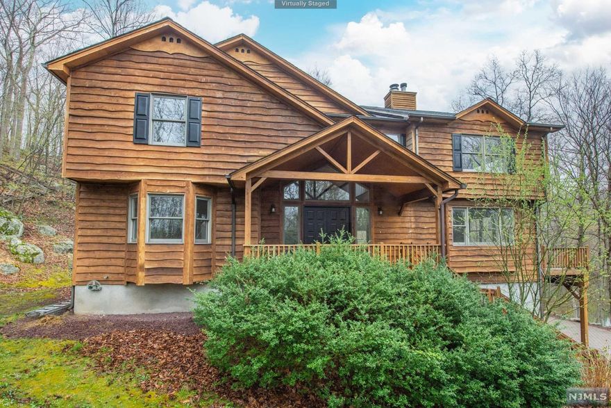 Your private getaway. Only 30 MInutes from NYC. Top rated schools Surrounded by trees and pond. Can swim,fish or ice skate on Forge Pond in your yard. This custom 1995 home features distinct Wavy Edge Cedar Siding which is used on ski chalets. You will be impressed by the views off your extended decks overlooking property. Inside home you will find 4 bedrooms and Office 3 full baths w over 4000 sq ft of live space. 2 woodburning fireplaces. Open architecture w lots of windows, hardwood floors,Modern eating Kitchen just some of features which make this home special. Nice size master bedroom w sitting area , fireplace, and great views from private deck. From the ctr island in kitchen you can see your sunken family room and living room.Etc