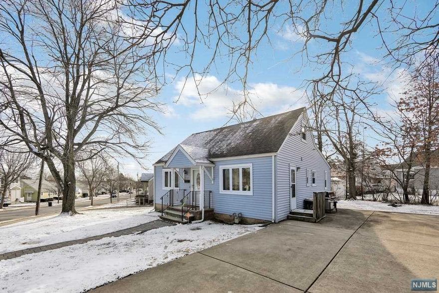 EXPANDED, Custom home offers comfortable living. Main level has EIK, Formal Living Rm and Formal Dining Rm great for entertaining, Main Full Bath, 2 sizeable bedrooms plus Large Master Bedroom addition. 2nd level offers 4th Bedroom and open leisure room for multi purposes. Full, finished basement has spacious Rec Rm for extended living, office area and laundry room. Central A/C to keep cool on hot summer days, Gas heat, Hardwood Floors, Brand new HtWtHt, Thermal Windows, 2 Car wide Driveway for convenient off street parking and more! Located in residential area near highways, shops, schools. 1 Block to NY public transp. A MUST SEE!