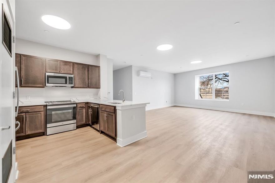 Discover refined urban living in this spacious 2 bedroom, 2 bath unit located on the second floor of a newly built 18-unit elevator building, this corner home gets a ton of natural light. The open layout features a kitchen with LG stainless steel appliances, an electric range, and a dishwasher. The primary bedroom includes a walk-in closet and private en-suite bath, while the second bedroom offers flexibility for guest bedroom, guests, or additional lounging. A second full bath, dual zone heating and cooling, and oversized windows add to the comfort and livability. Residents enjoy access to a stylish lounge, basement laundry, and secure bike/scooter storage. Covered garage parking is available for $150/month. Net effective pricing with (one month free on a 24-month lease). Ready for immediate occupancy.