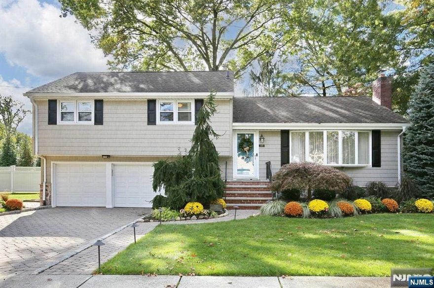 This stunning split-level home located in the desirable town of Oradell, is the epitome of luxury and comfort, with no expense spared in its design and finishings. Offering 4 spacious bedrooms and 2-1/2 beautifully appointed bathrooms, this home exudes elegance from every corner.Step into the elegant living room w/large bay window. fireplace and custom built-ins. The gourmet kitchen is a chef's dream, featuring custom cabinets, stunning woodwork, top-of-the-line appliances, and sophisticated finishes. The family room with coffered ceilings, gas fireplace and a wall of windows overlooking the lush landscaped property is the perfect retreat for relaxing or entertaining. The finished basement offers a custom-built bar complete with a wine fridge and a spacious pantry. Every detail in the home exudes quality,from the Carrara marble primary bath to the 9 ft. ceilings. This is the kind of home where the photos simply can't capture the true essence. Come and see for yourself!