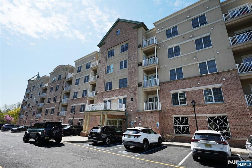 VERY BRIGHT CONER END-UNIT, FACES EAST & SOUTH. UPGRADED RENOVATION WITH HARDWOOD FLOORS THROUTHOUT. SPACIOUS LIVING ROOM WITH TERRACE. OPEN KITCHEN WITH GRANITE CONTERTOPS AND S/S APPLIANCE. MASTER BEDROOM WITH TWO WALK IN CLOSETS & DOUBLE SINK, SEPARATE GLASS SHOWER. FULL SIZED LAUNDRY IN UNIT. MODERN STYLE CLUB HOUSE WITH FITNESS CENTER. ONE DEEDED INDOOR PARKING SPACE. PLANTY OF ADDITIONAL PARKING FOR GUSTS AND EXTRA CARS. MINUTES FROM GWB & MAJOR HIGHWAY. COMPLEX OVERLOOKS BEAUTIFUL OVERPECK GOLF COURSE.
