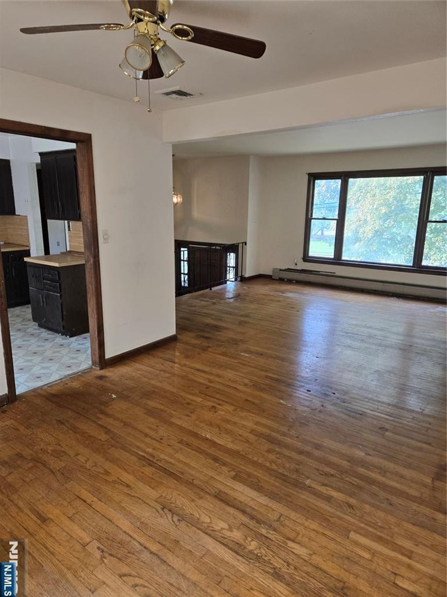 Unique opportunity in highly desirable Paramus; property is currently an office with residence above. Continued use as "home occupancy", SINGLE FAMILY HOME, 2-FAMILY conversion (with variance) or mixed-use (with variance) are possibilities here. Lots of natural light and large closets throughout. Kitchens and bathrooms need updating but building overall solid. Great for general or trade contractors. Property features include: Upstairs/2nd Floor: 3 large bedrooms, 2 full baths (one ensuite), eat-in kitchen, living room, and dining room. Downstairs/1st Floor: 2 private offices/bedrooms, large bullpen space/3rd downstairs bedroom Kitchenette/4th bedroom, and 1 half bathroom. One car garage and parking for 6+ cars in driveway. Agent is related to owner/seller. Also listed as Residential (MLS #25037051)