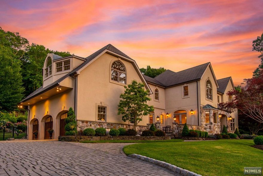 Stately and Elegant! Situated on a Premier Cul de Sac property inside the gates of Smoke Rise with incredible Mountain Views this Luxury Estate is an Entertainers Delight boasting spectacular oversized rooms with Beautiful custom moldings, architectural details, high end quality and craftmanship throughout. Meticulously maintained, featuring 5 BR, 5.1 BA, 3 Car Oversized Heated Garage, an Exquisite MBR suite with walk in closets and Master BA, finished LL with Wet Bar, Full BA and Theater Room. Exterior features a private back yard Oasis with IPE deck, Natural Stone Patios, Gunite heated Saltwater Pool, Spill Over Spa & Separate Waterfall situated adjacent to State Land and Watershed property with direct access to endless hiking and quadding trails. Smoke Rise is one the finest private lake communities offering 24hr security, access to Lake Kinnelon with beach, swimming, snack shack, lifeguards, BBQ grills, basketball, playground, boating & fishing. Vacation Year Round here!