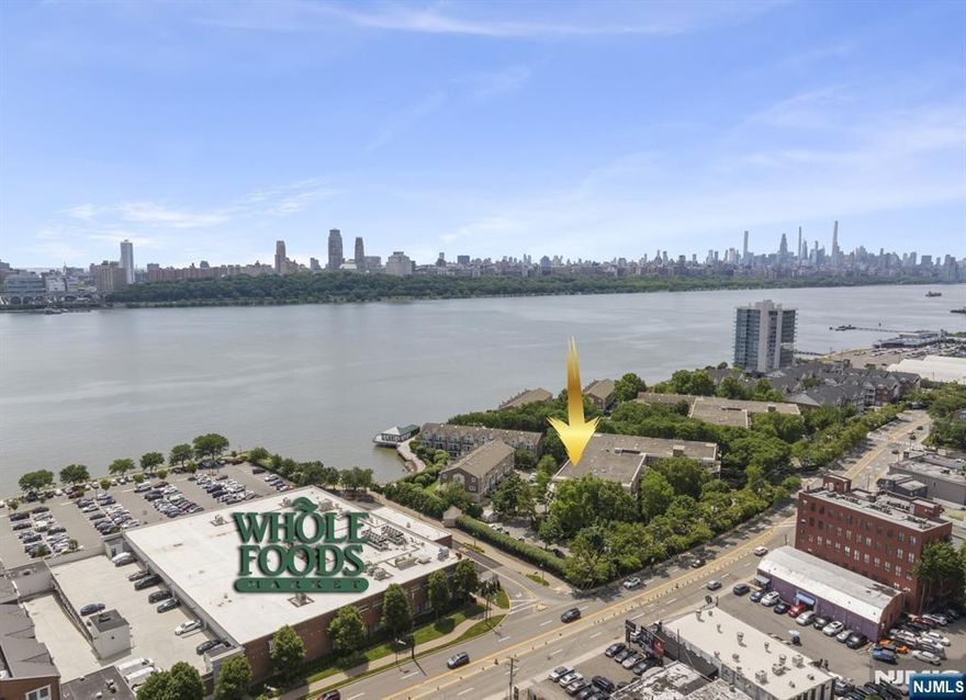 Step into the LARGEST floor plan of both buildings at "Grand Cove": A gated community on the Hudson River that is like a mini oasis. From the tranquil tree canopy over the quiet grounds, to the beautiful flowers & sea grass. Relax at the great pool that has incredible Manhattan & river vistas. There's also a club house right over river that can be rented for parties. This pristine home has been renovated and decorated in a way the feels like a classic Manhattan apt.. From the crown molding and gleaming hardwood floors to the stunning bathrooms, this home will not disappoint. It is on the quiet, east facing side of the building, with a nice terrace. The split floorplan allows the separation of bedrooms with a large living dining room appxorx. 17" ft wide x 30" ft) long. The master bedroom easily fits a king size bed and has a large walk-in closet. It has a sparkling white bathroom with a walk-in shower stall and a jacuzzi tub. The galley kitchen is renovated with granite counter tops and SS appliances and comes with an ornate chandelier; w/everything at your fingertips. A great place to live that is also next to the Whole Foods, close to the Edgewater ferry, bus stop, & major highways. [All light fixtures and sconces are not included but will be replaced (except in kitchen). Garage spot is add'l $125 p/mo. and has a transfer fee of 1,000].