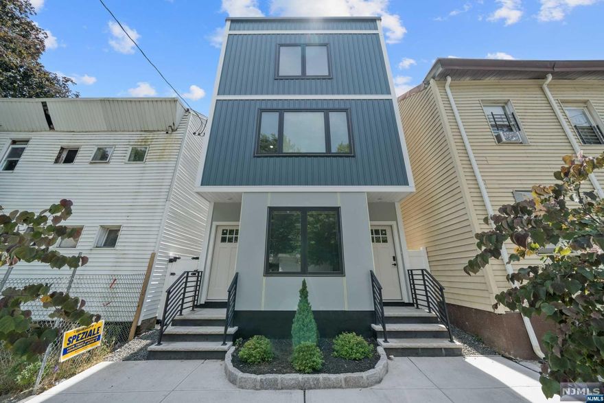 This newly constructed two family home featuring side by side duplex units at 31 Stout St, Paterson, NJ is a must see. (Approved Five Year Tax Abatement!) Each unit features 3 spacious bedrooms, 2 modern bathrooms, a generous living/dining area, and a stylish kitchen equipped with full stainless steel appliances. Each unit also features an in unit washer/dryer, and Central A/C. Unit 1 is Vacant, and Unit 2 has the option to be delivered Fully Furnished! This property is ideally situated just minutes from major highways (4, 21, 80, and Route 3) and offers easy access to New Jersey Transit bus and train services. Enjoy the convenience of being a short distance from Passaic County Community College, a variety of restaurants, and beautiful parks. Seize the opportunity to enjoy upscale living in the rapidly evolving neighborhood of Paterson.