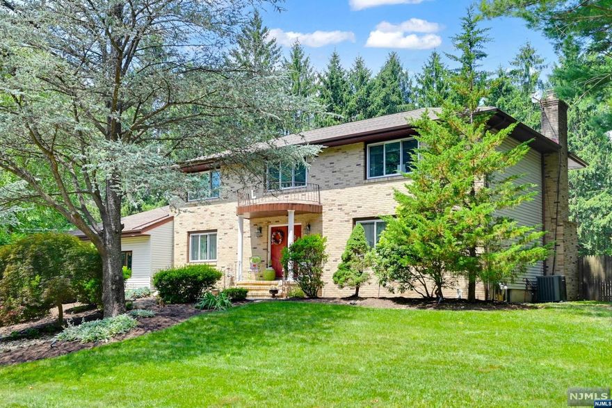 Welcome to this bright and spacious Center Hall Colonial on private, fenced 1/2 acre+ property located on quiet cul-de-sac. The entry foyer leads to sunfilled living room and dining room. Granite and stainless kitchen with dining area opens to the family room with woodburning fireplace and sliding doors to deck. There is a first-floor bedroom/office, laundry and full bath. Upstairs you will find a kingsize primary bedroom with walk-in closet and updated bathroom, three additional bedrooms and main bath. Set on beautifully landscaped property, the back yard is your private oasis with expansive deck, inviting pool, paver patio with firepit and lots of green space - the perfect place for entertaining!