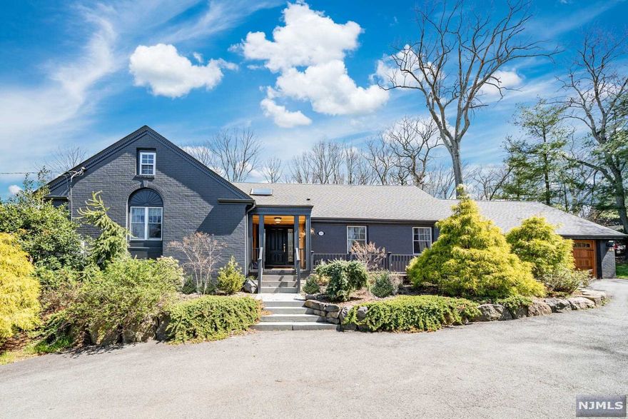 Nestled in the ULTRA-desirable East Hill section of Englewood, you will be truly impressed with this DESIGNER home from the moment you set your eyes on it. Beautiful renovations throughout the home. Gracious two-story foyer upon entry. DREAM gourmet kitchen features an oversized island with waterfall quartz countertops and quartz backsplash. Professional appliances, state-of-the-art hood, and high-end custom cabinetry. Kitchen is open-concept and overlooks the ultimate family room with floor to ceiling windows. First floor primary bedroom with en-suite full bathroom, den / office (or 5th bedroom), powder room, plus formal living and dining rooms complete the first level. Find three additional spacious bedrooms upstairs plus another full bathroom with a soaking tub and glass shower. Serene and spacious fully fenced in backyard with fabulous deck. Two car garage plus circular driveway and charming front porch. Prestigious location only minutes from NYC. Do not miss...