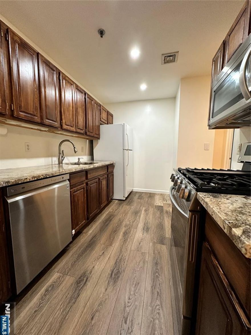 Welcome to this well-maintained, bright and spacious 1,064sq 2 bed, 2 bath(MBR/MBTH, BR, FBTH) east-facing unit located on the top floor of a mid-rise apartment building built in 2003. upgraded bathrooms and kitchen. This unit includes 2 covered parking spaces and a storage room. Storage and washer/dryer are in the same floor. SMART light and Thermostat can control with your phone. LOW TAX ($5907/YEAR) and MAINTENANCE ($377.65/m). Plenty of visitor parking spaces. Security cameras on common area. Secured lobby. Convenient to shopping, school, transportation, high ways, express NYC transportation only one block away. The seller has a NJ real estate license.