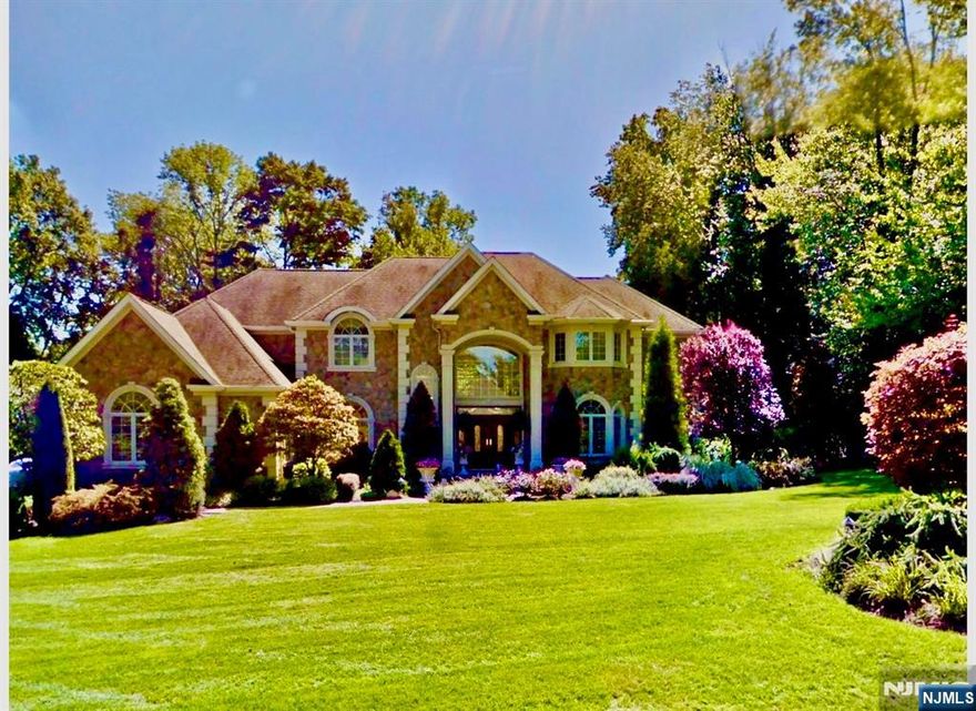 Set within one of Franklin Lakes most prestigious neighborhoods, this exquisite stone manor is a statement of timeless elegance and resort-style living. Sited on a great property it offers extraordinary outdoor entertaining space featuring pool with 5 waterfalls, spa and outdoor kitchen, capturing the culture and lifestyle of this distinguished residence. An inviting interior begins with a 2 story entry foyer, with sweeping curved staircase, custom Italian tile floor flowing into an impressive family room with extensive custom millwork, fireplace, corner wet bar and French doors opening to the patio and grounds beyond. The chefâ€™s kitchen is truly the heart of the home, offering a substantial center island, abundant custom cabinetry, and separate breakfast area enhanced by hand-painted murals. The main level also features a spacious formal dining room, elegant living room, laundry, office, and 1st floor bedroom with full bath. An additional first floor kitchen provides flexibility for entertaining, kosher use, or a thoughtfully designed first-floor in-law suite. Second level reveals a luxurious primary suite wing, complete with fireplace, sitting room, 2 walk-in closets, and spa-like bathroom. 3 additional en-suite bedrooms complete this level. An Entertainerâ€™s dream basement offers a recreation room, mahogany bar, 3rd kitchen, gym with sauna, bedroom 6, full bath, and storage. A truly exceptional home offering sophistication, scale, and unmatched lifestyle in Franklin Lak